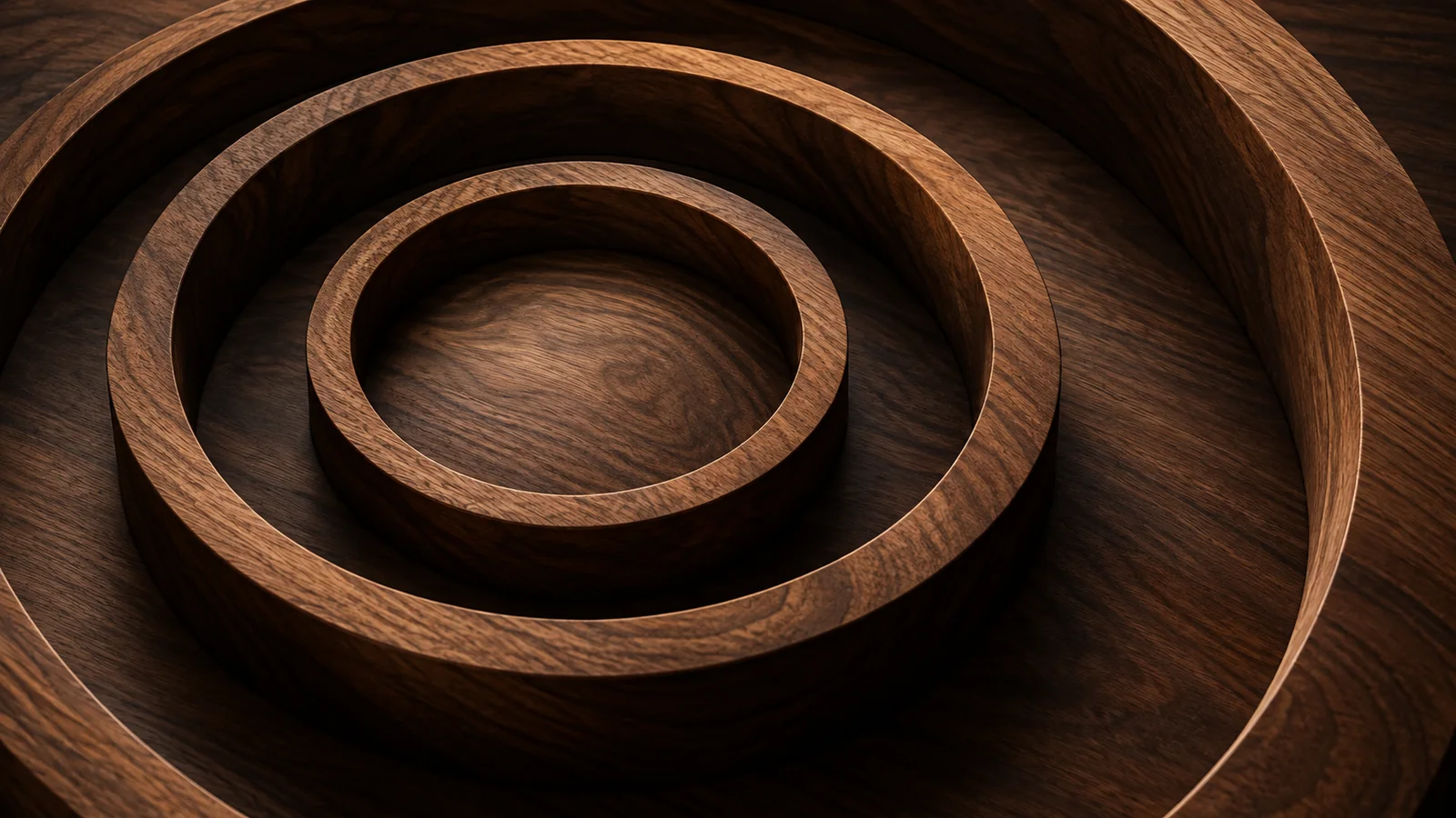 Concentric walnut-wood rings at different depths, extending beyond the frame
